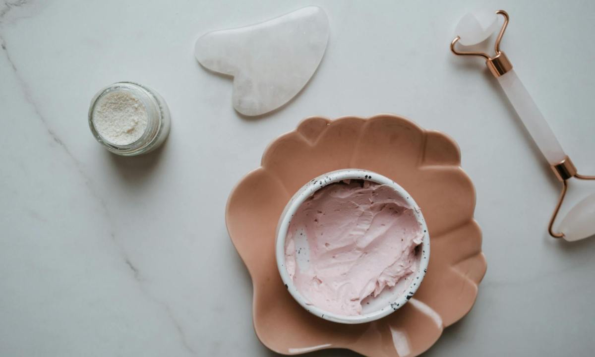 pink thick skincare product on white background