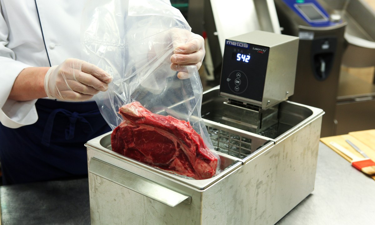 Chef preparing sous vide steak