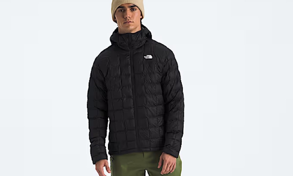 A model wearing The North Face Men's ThermoBall Hoodie 2.0.
