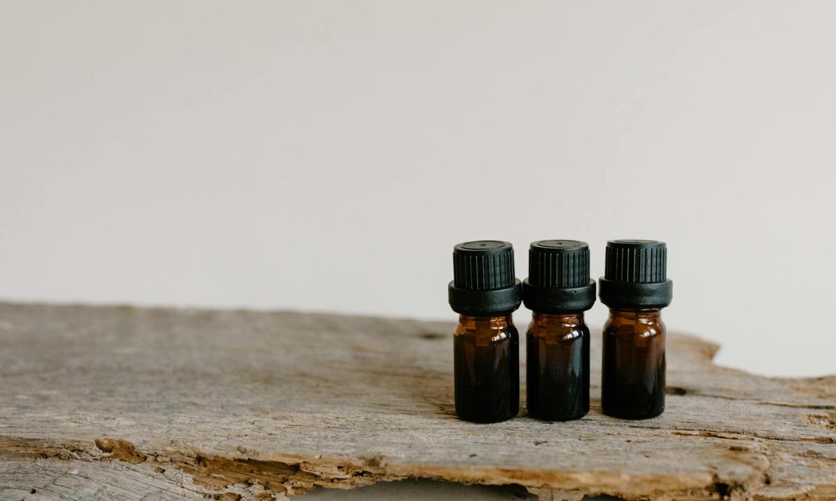 three oil bottles on wood