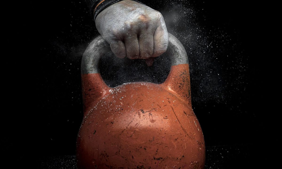 Hand holding kettlebell close up