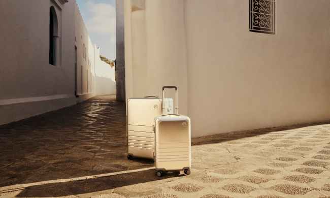 Monos aluminum luggage sitting outside