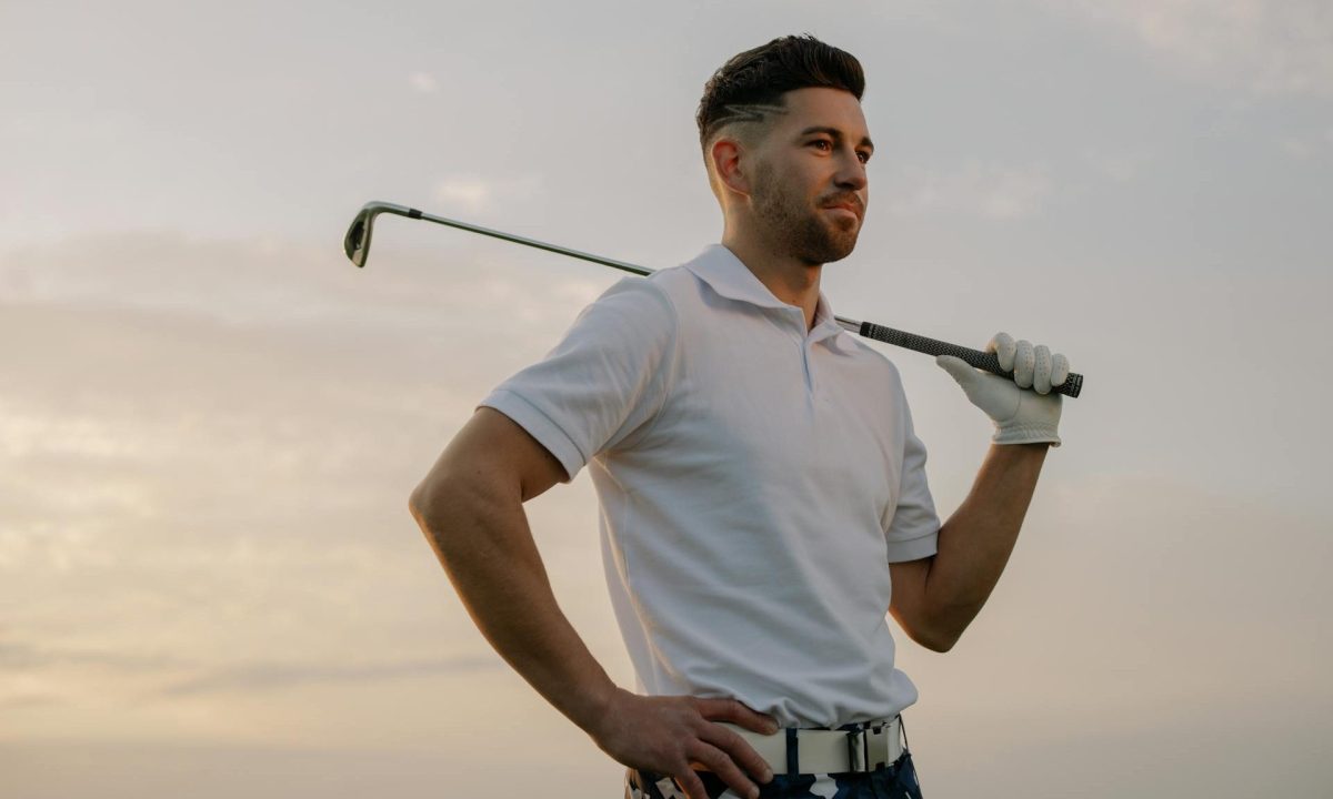 Man holding a golf club over his shoulder
