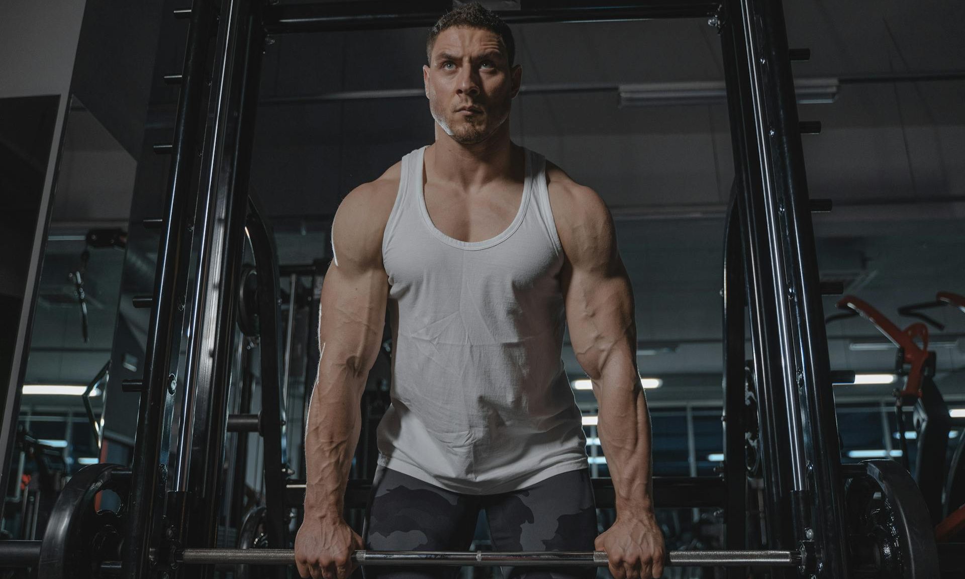 man lifting barbell strong muscle