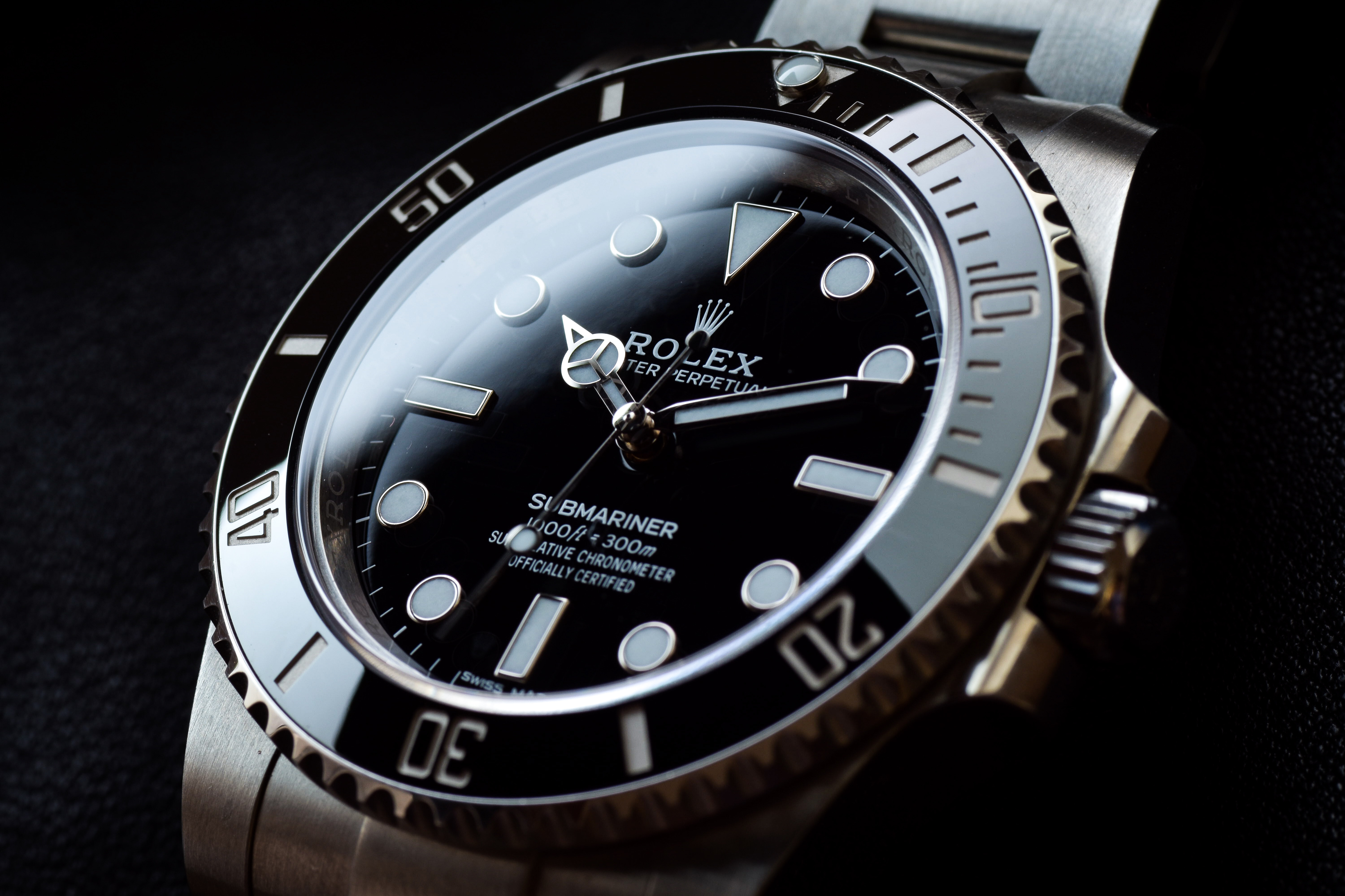 A Rolex Submariner with a black background