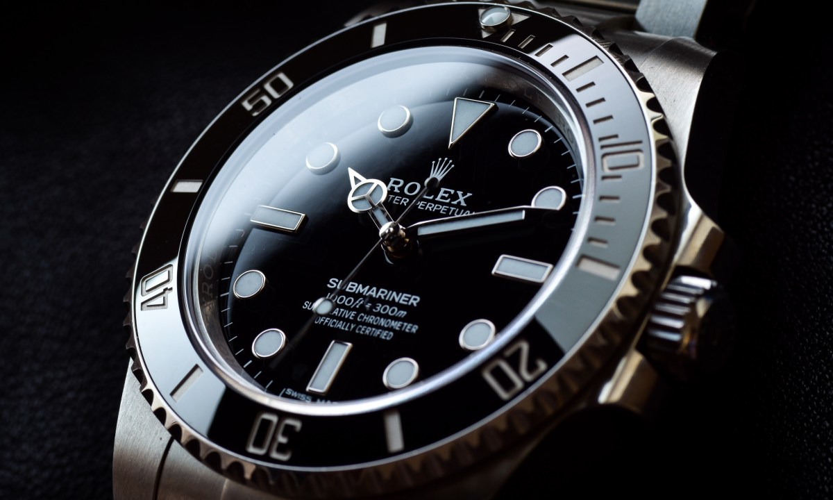 A Rolex Submariner with a black background
