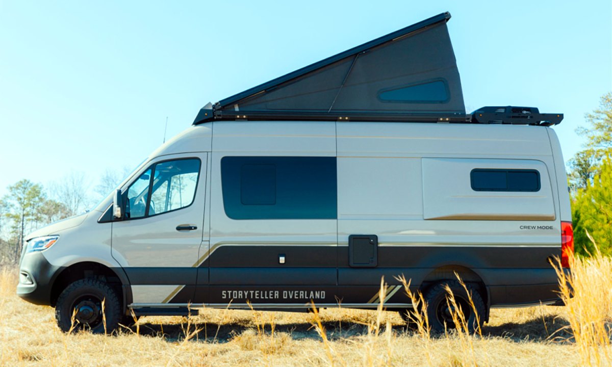 Storyteller Overland's Crew Mode campervan parked with its rooftop tent popped up.