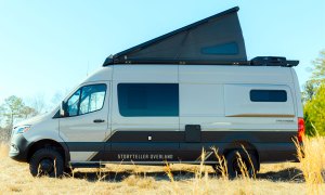 Storyteller Overland Crew Mode adventure van camper with its rooftop tent popped.