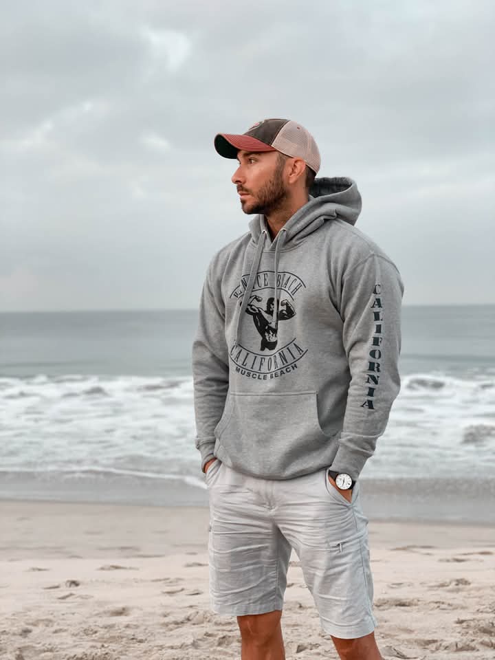Man by the beach wearing timepiece.