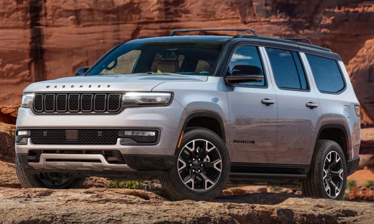 A limited-edition 2025 Jeep Wagoneer Overland parked on a rocky desert outcrop.