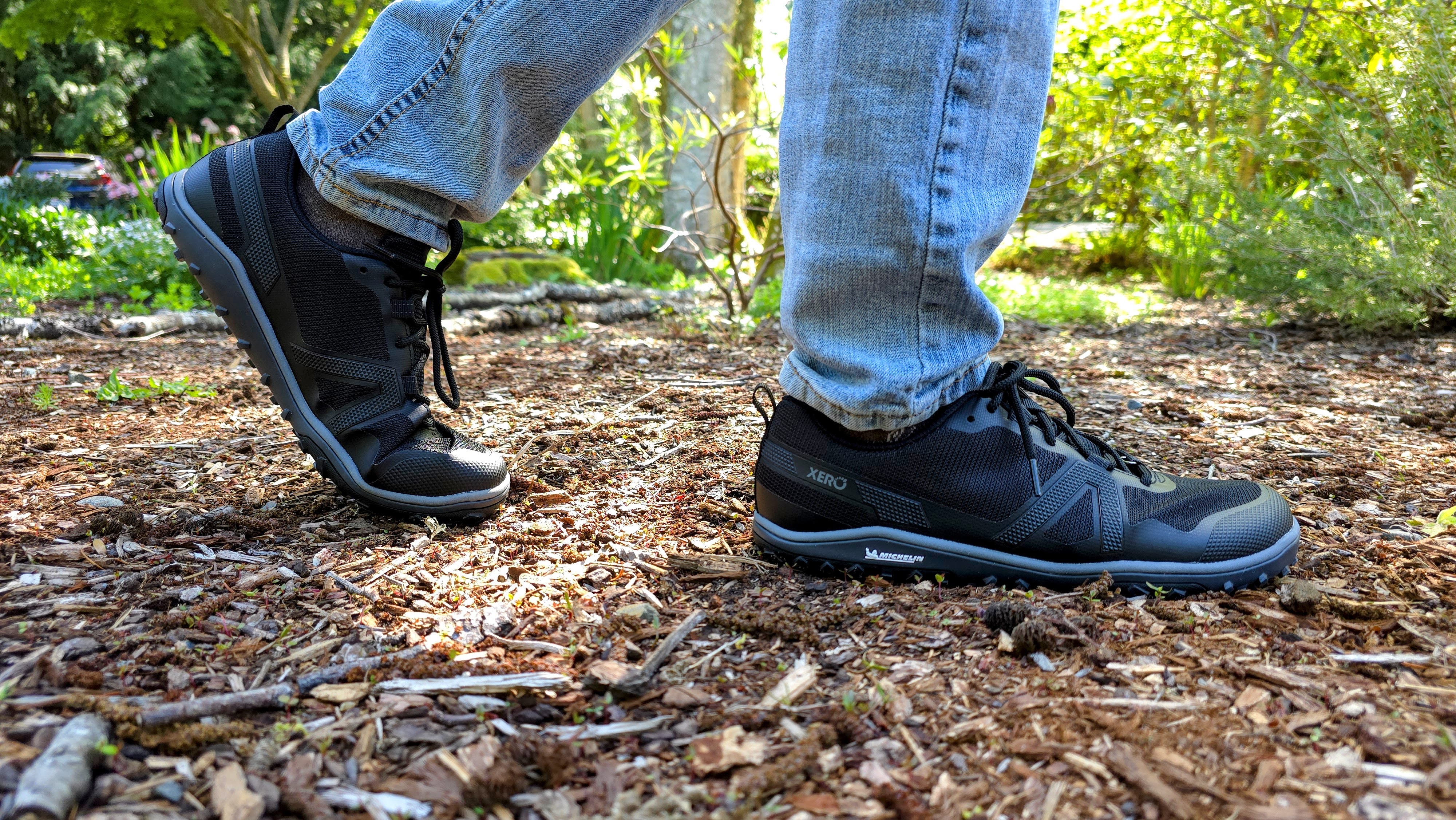 A man wearing Xero shoes while walking