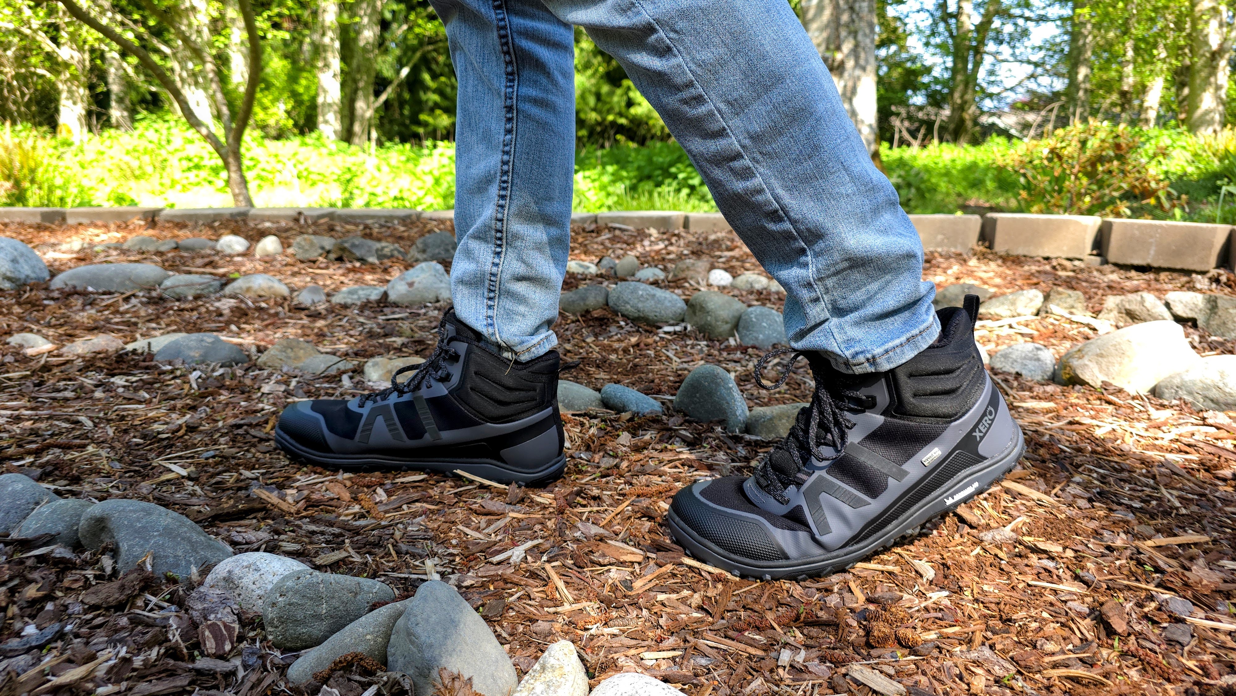 A man wearing Xero hiking boots while walking