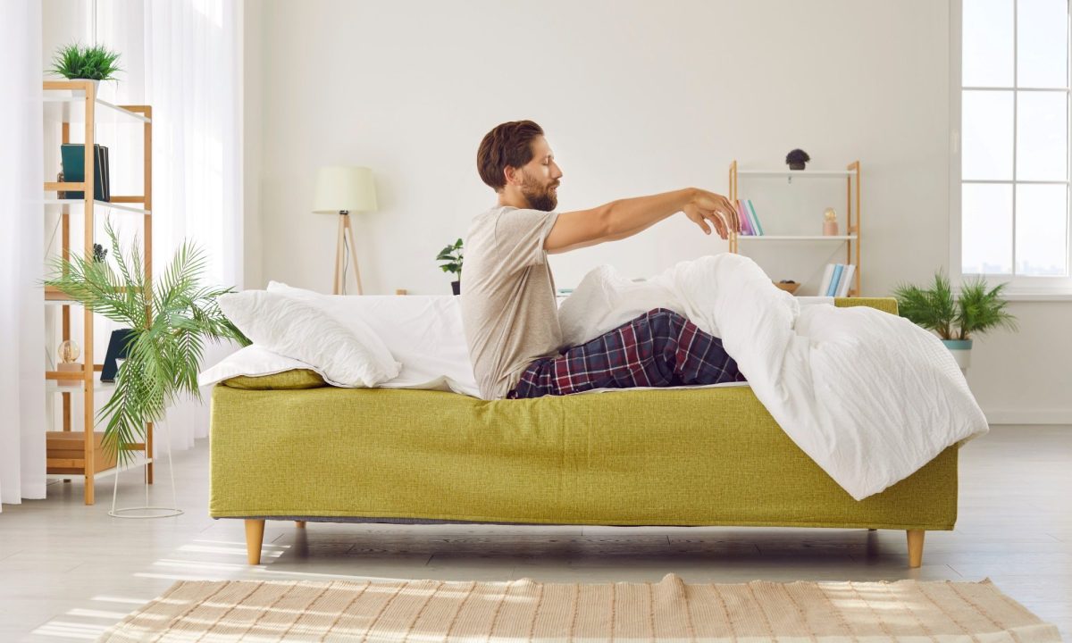 man sitting up in bed zombie sit up