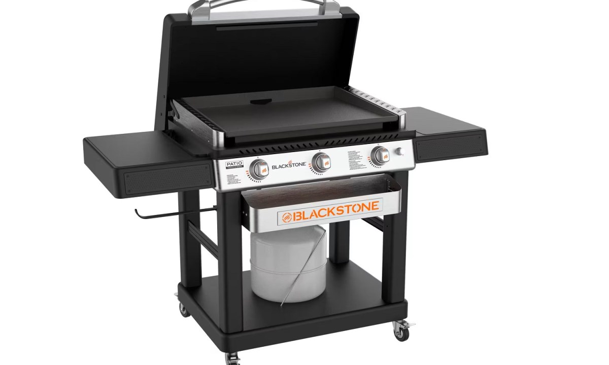 The Blackstone 28-inch Griddle with Hood and Adjustable Front Tray on a white background.