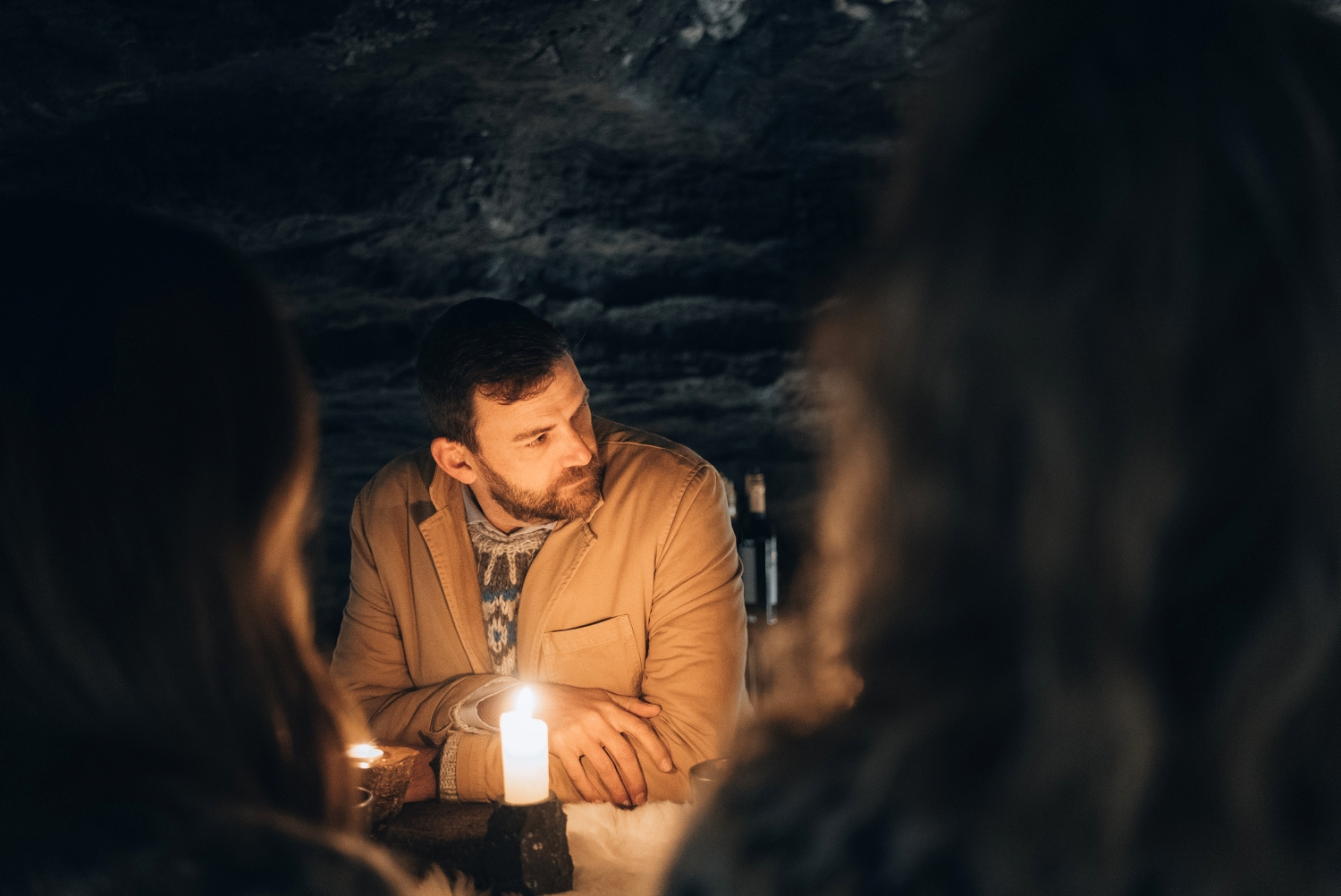 Man in Icelandic sweater in candlelight