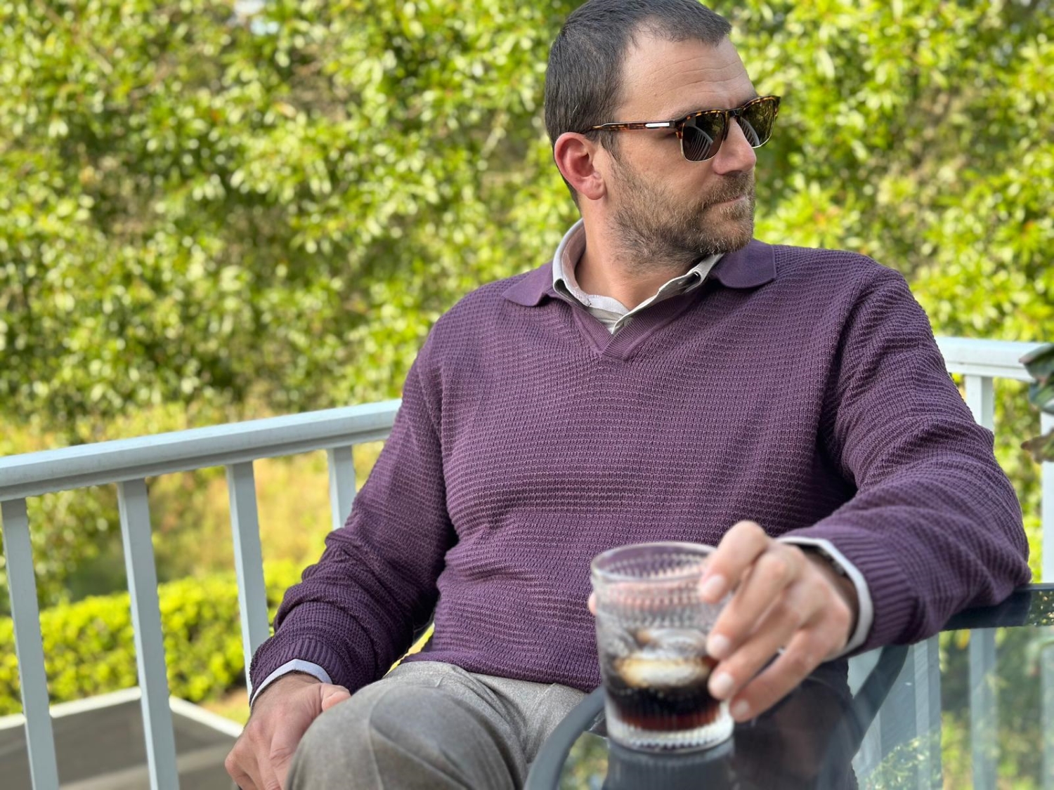 Man in burgundy sweater polo