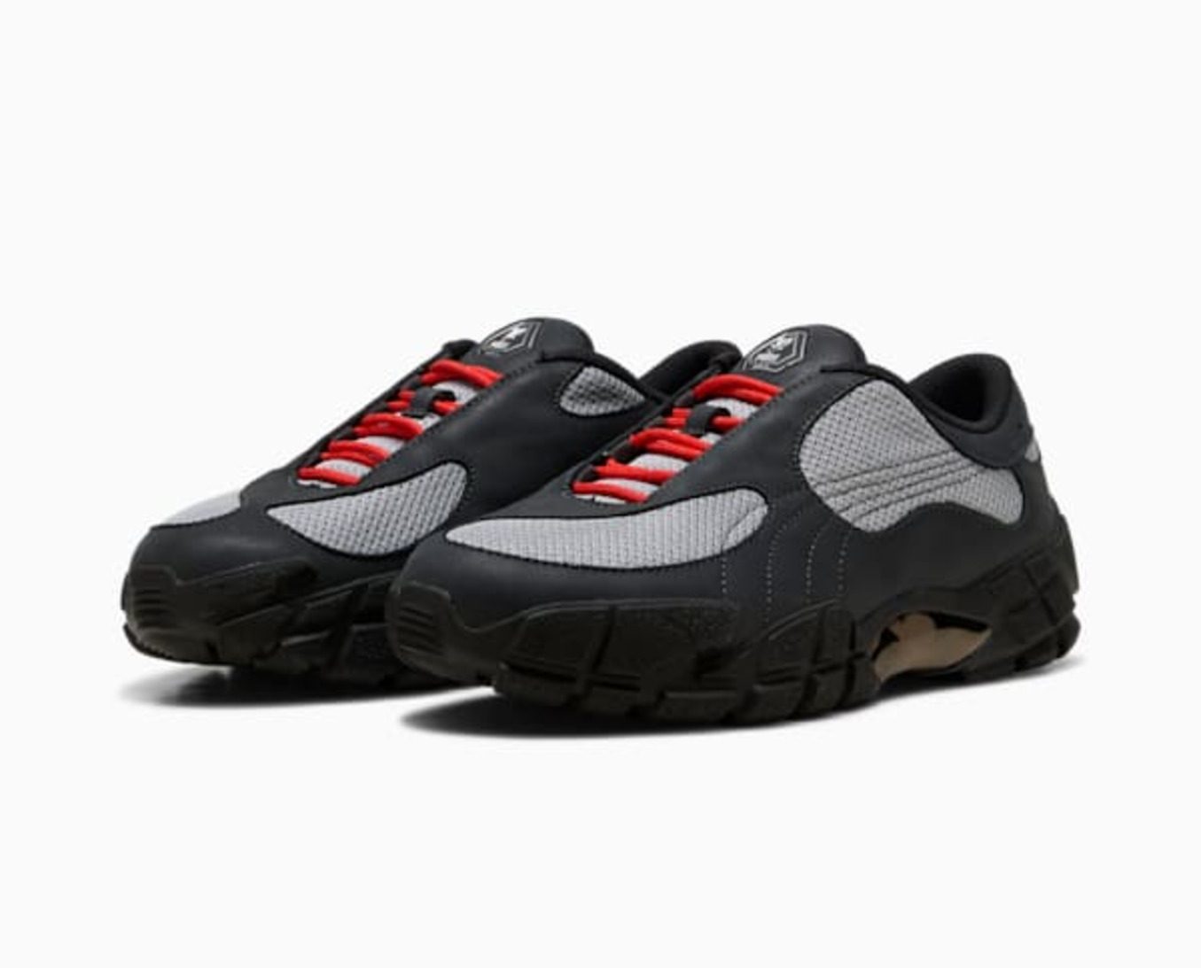 pair of black puma skepta sneakers