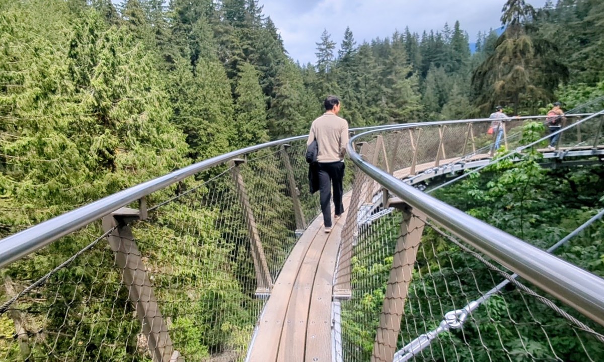A man walking on the cliffwalk in vancouver