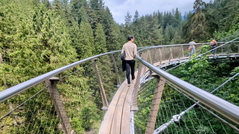 A man walking on the cliffwalk in vancouver