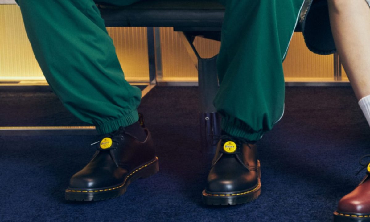 model wearing black dr. martens