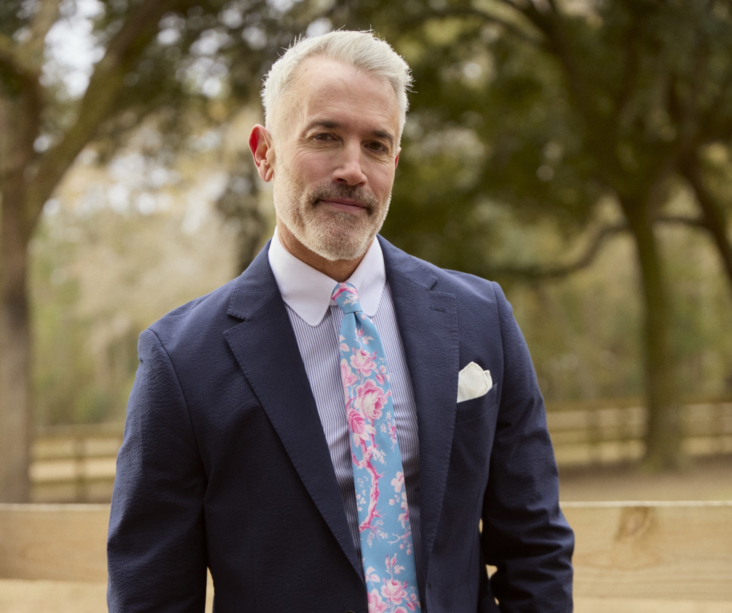 TieBar x Laura Ashley man in blue suit and floral tie