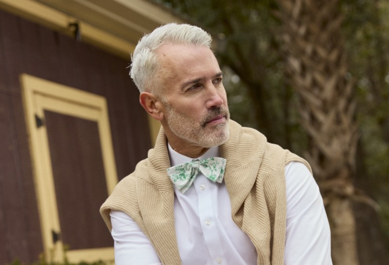 TieBar x Laura Ashley man in bow tie and sweater