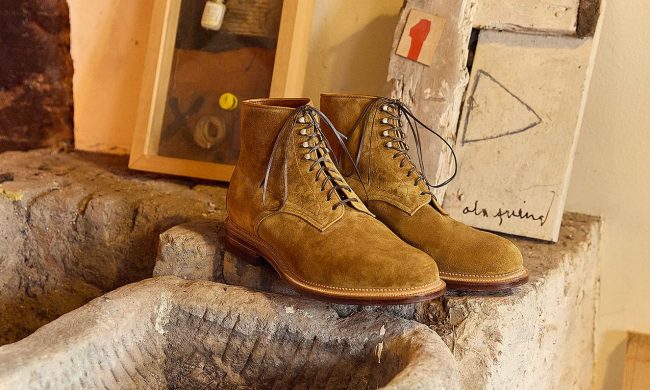 brown viberg boots on stone counters in art studio