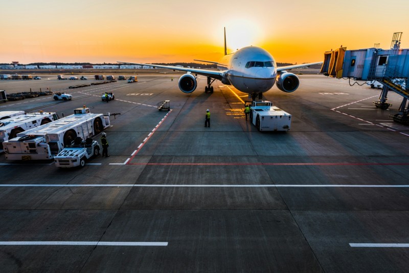 Airplane at gate sunrise