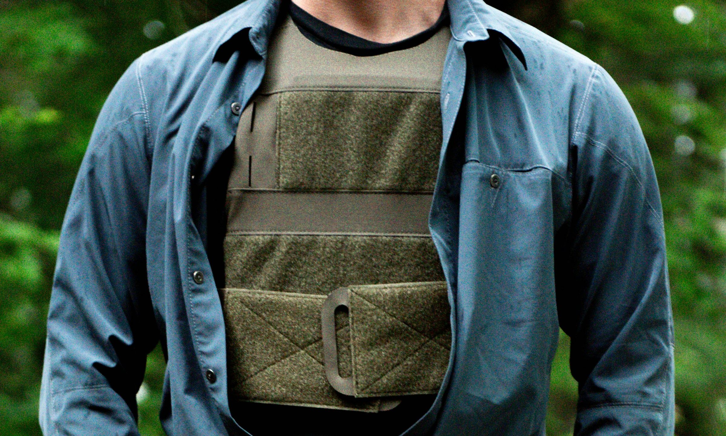Man wearing blue shirt and weighted vest