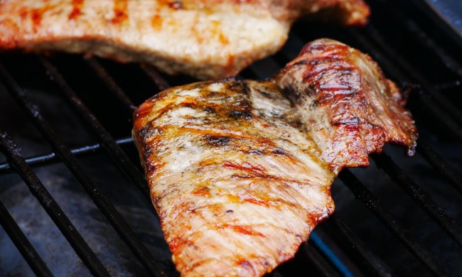chicken cooking on a gas grill