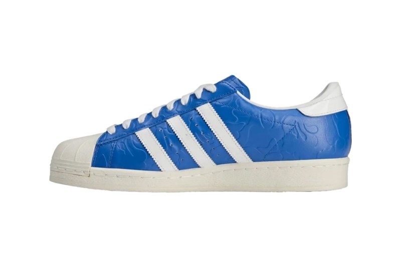 side of blue and white superstar sneaker