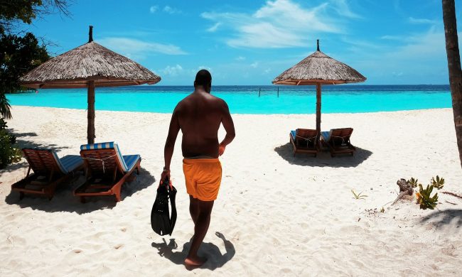 man walking on the beach