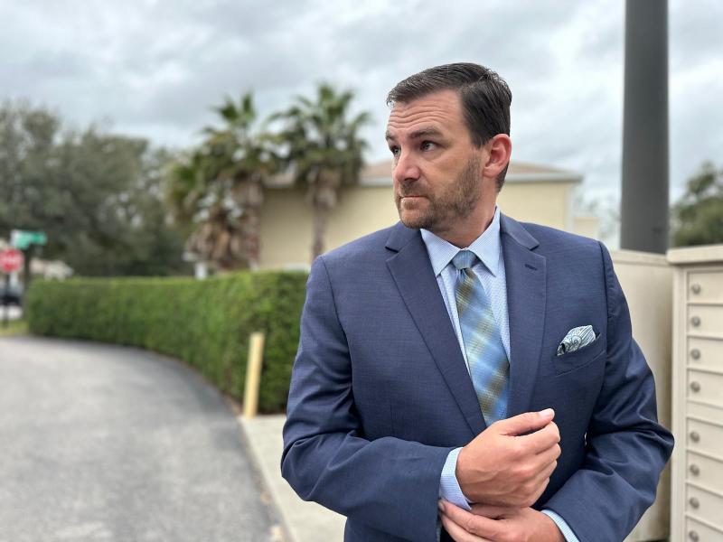 man in blue suit and shirt