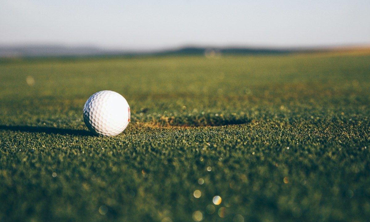 Golf ball near the hole