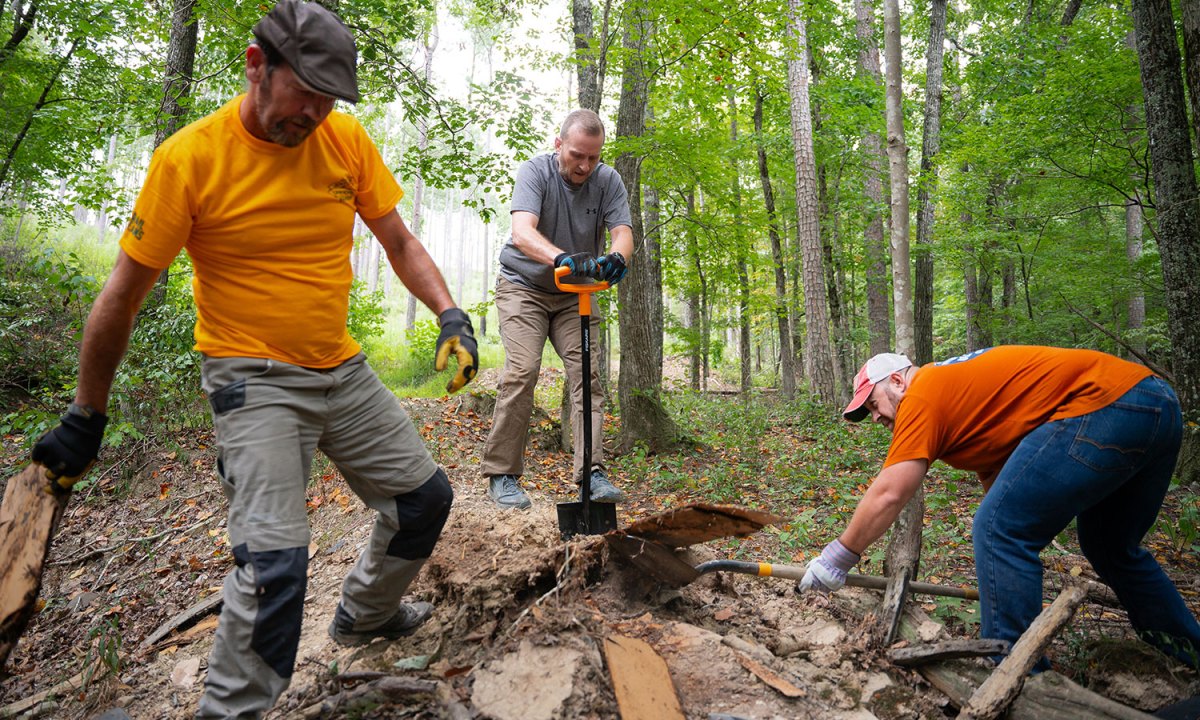 People work to clean up a trail with the nationwide onX x Toyota Trail Revival Project.