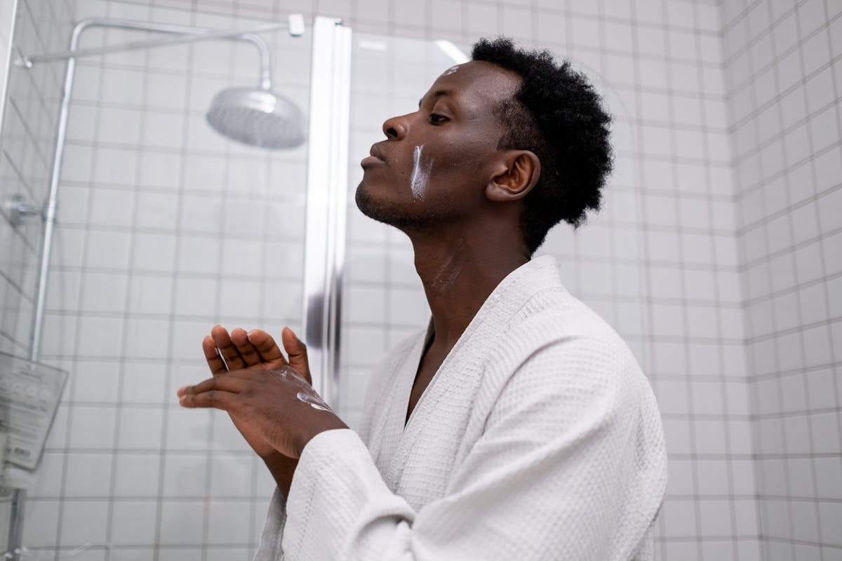 Man doing skincare bathroom