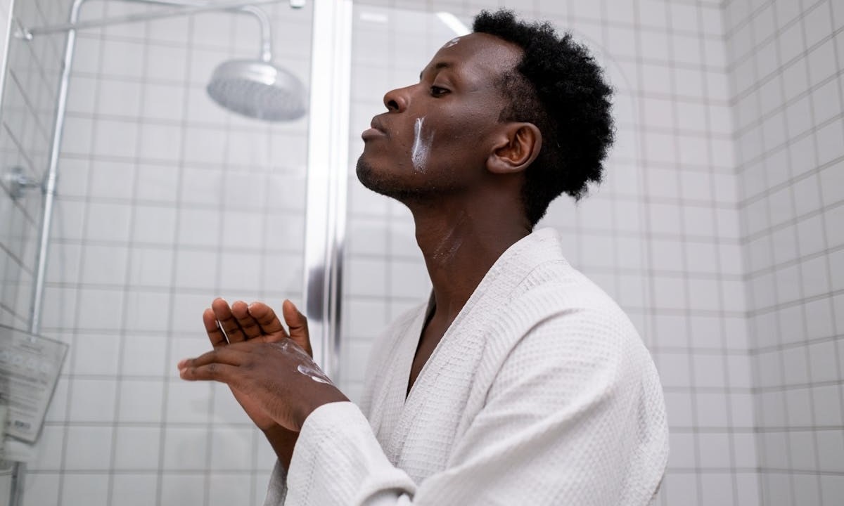 Man doing skincare bathroom