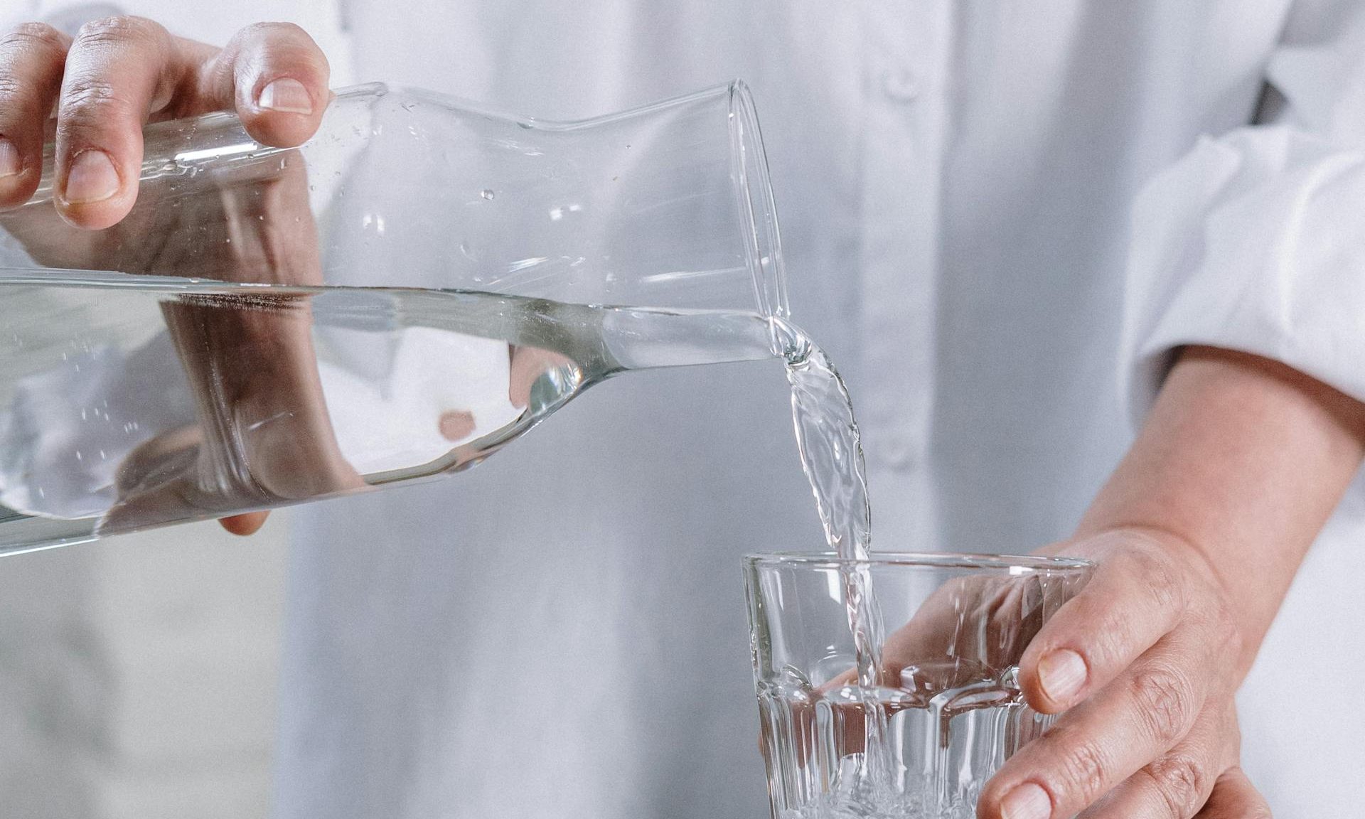 Man pouring a glass of water