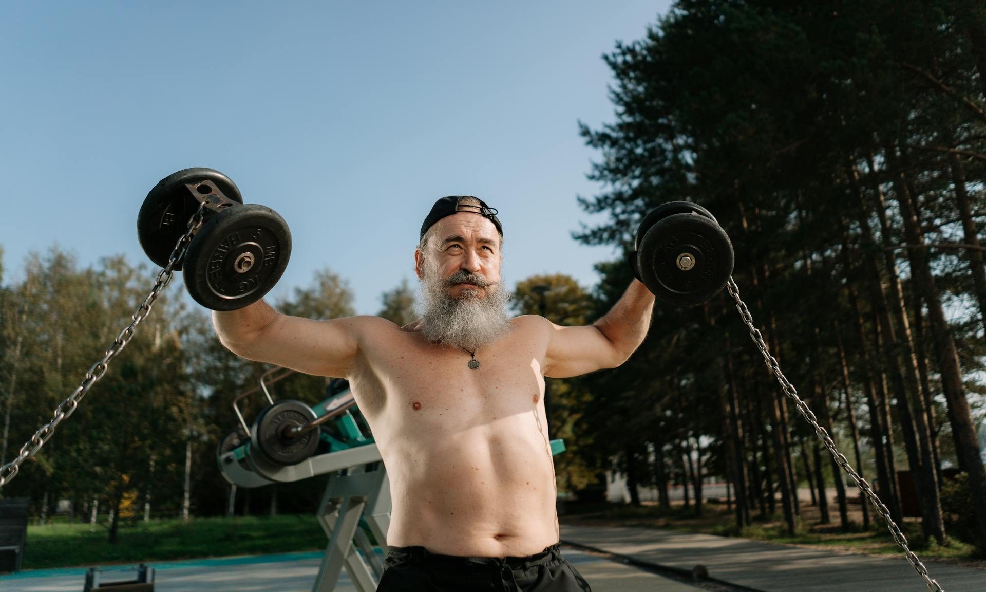 Older man working out lifting weights
