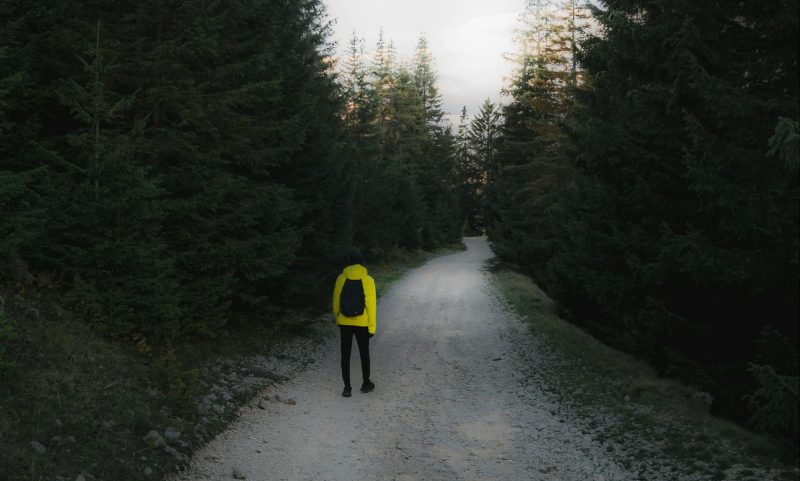 Man walking outside hiking rucking