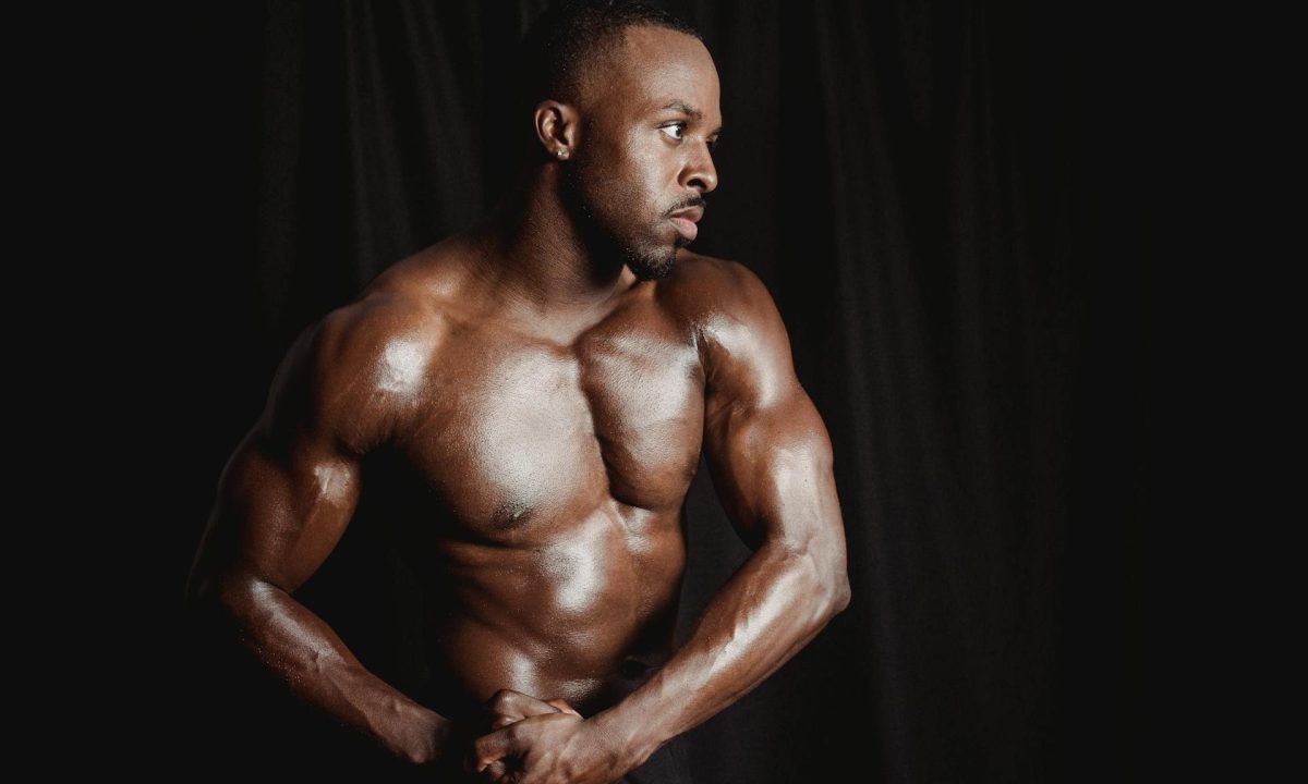 man flexing muscles strong arms