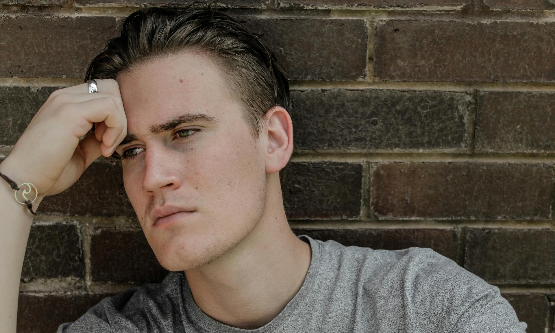 man looking sad thinking reflective