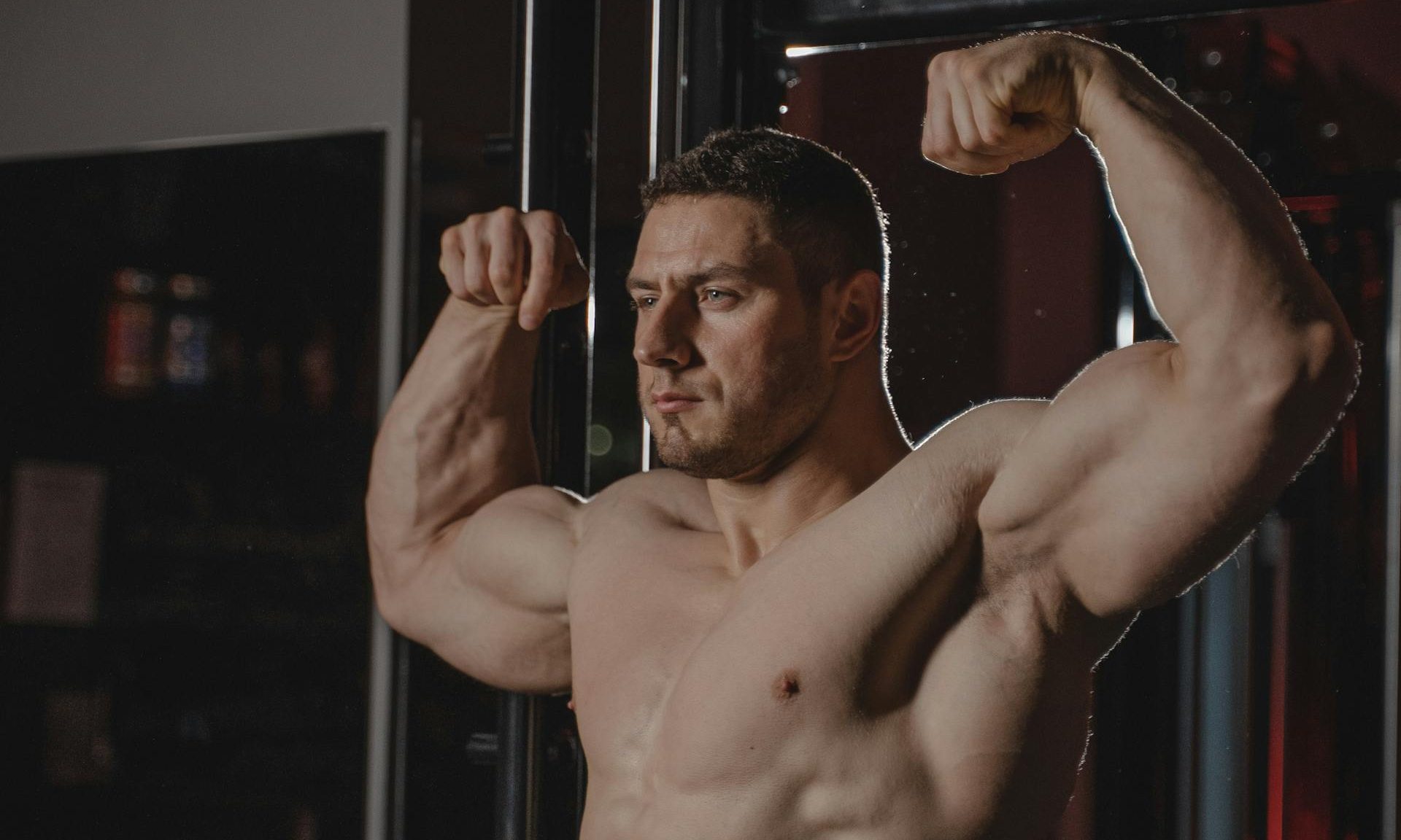 strong man flexing arms biceps