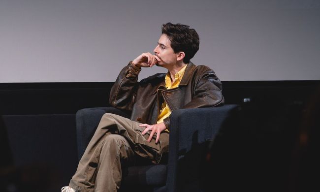 Timothee Chalamet sitting at a Q&A in New York City.