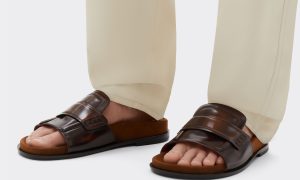 man wearing ferrari leather sandals