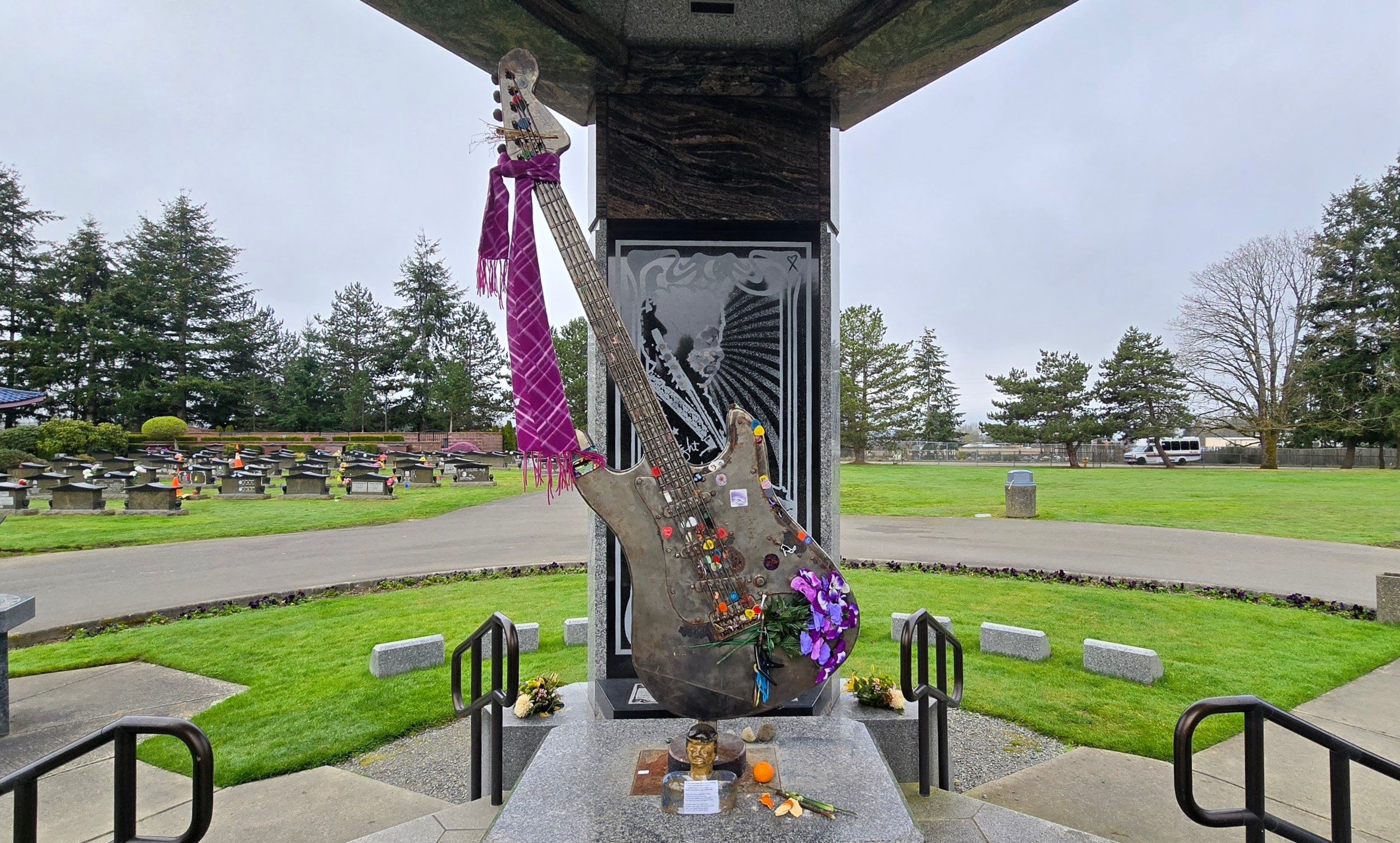 Jimi Hendrix Memorial featuring guitar adorned in offerings