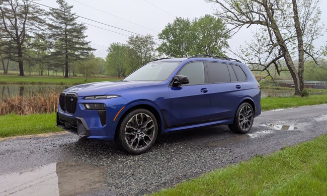 Front 3/4 view of a a blue BMW X7 M60i