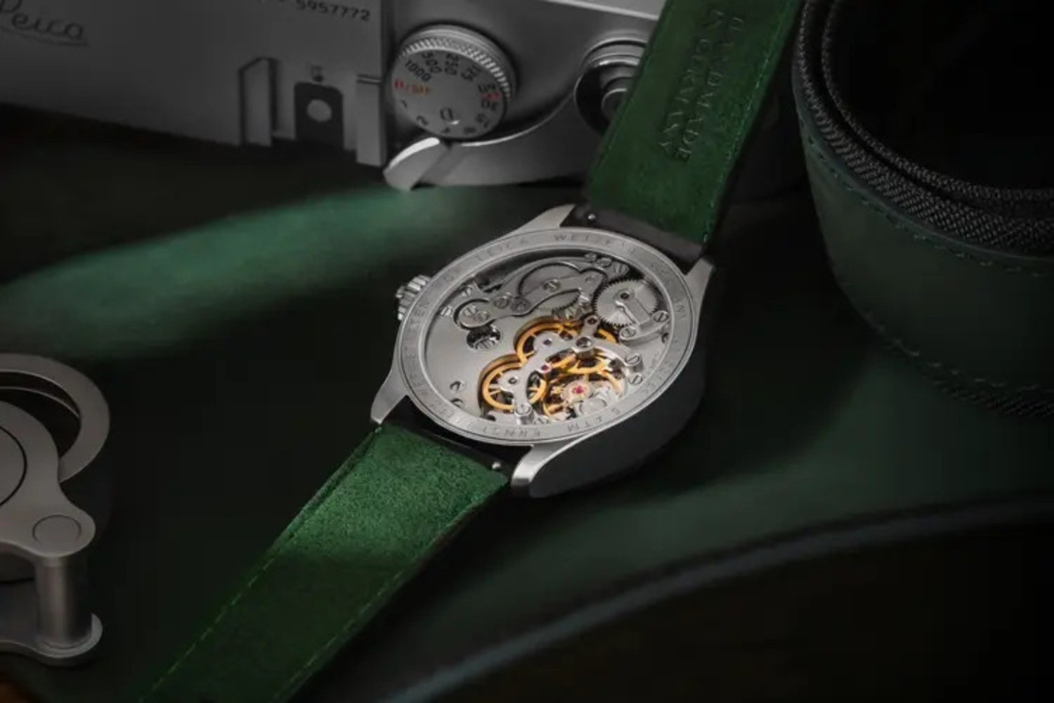 Back view of Leica timepiece with green strap