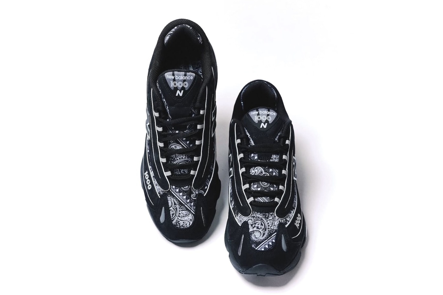 overhead shot of new balance x atmos sneakers