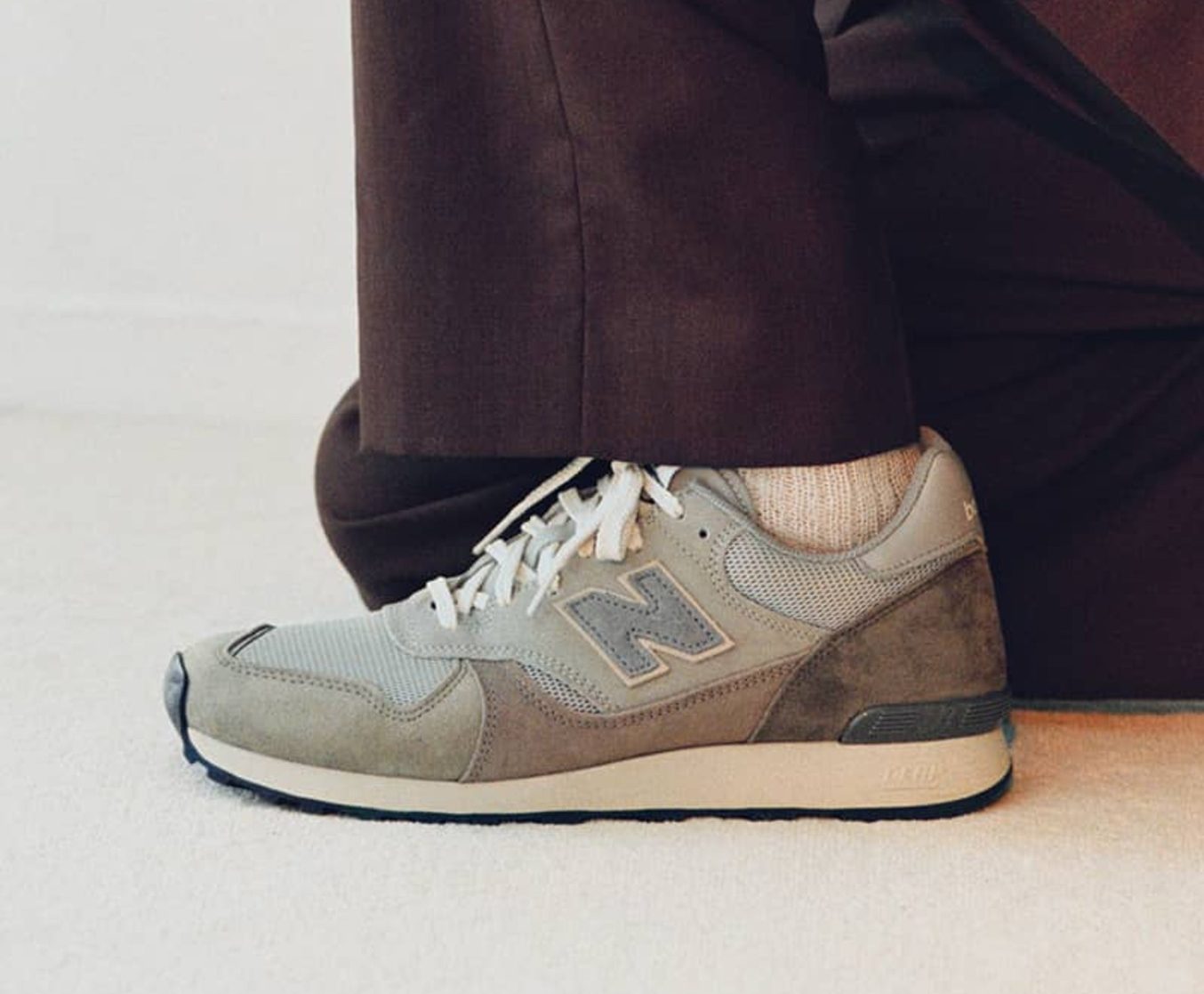 close up on grey auralee new balance sneaker